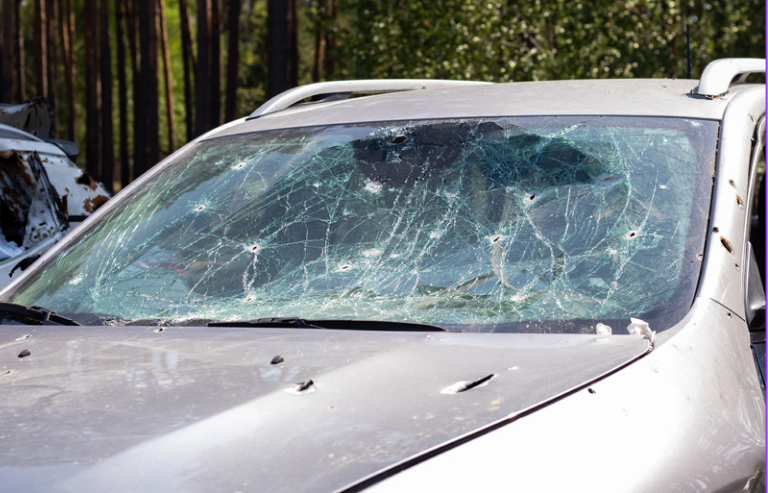 bullet holes in car